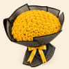 Large bouquet of yellow roses wrapped in black paper with a yellow ribbon