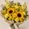 Yellow sunflower bouquet with roses and carnations wrapped in beige paper