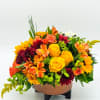 Autumn Copper Cascade: A lush cluster of fall-colored blooms and greenery gathered