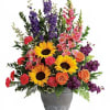 "A colorful reminder that brighter days are ahead, this uplifting arrangement of
