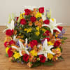 Mixed bouquet with red roses, white lilies, and yellow daisies