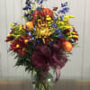 This grand vase boasts colors of a crisp fall morning. Filled to