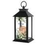 Black memorial lantern with leafy design and script text on the front panel