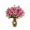 A lush cluster of lavender roses forms the centerpiece of this birthday