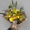 Yellow lily bouquet with mixed white and yellow flowers wrapped in brown paper