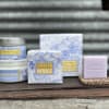 Lavender chamomile scented soap, candle, and body butter products on a shelf