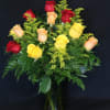A dozen roses in red, yellow, and orange for a fall-inspired arrangement.