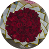 A lush dome of deep red roses that reads as pure romance