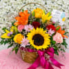Colorful mixed flower basket with a birthday sign and card