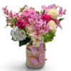 Pink and white mixed bouquet in a burlap-wrapped vase with butterfly decorations