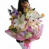 Pretty all pink and white seasonal bouquet filled with premium pink roses