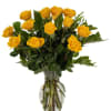 Yellow roses arranged in a clear glass vase