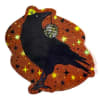 Decorative black crow illustration on a starry orange background
