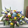 A luminous blend of purple roses and golden sunflowers creates an uplifting