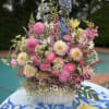 Mixed pastel flower arrangement in a white bowl vase