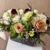 Warm, cozy blooms in a glass vase.