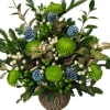 Green chrysanthemum arrangement with blue pinecones in a gold vase