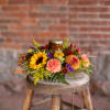 Illuminate the senses of Thanksgiving spirit with the delicate fragrant candle centerpiece.