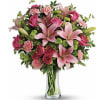 (ONE-SIDED) A vibrant bouquet of pink lilies, roses, and carnations arranged in