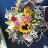 (WRAP-NO VASE) Spring Fever Bouquet is a vibrant and cheerful arrangement bursting