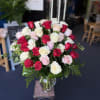 (ALL-ROUND) A 36 full, elegant arrangement of red, white, and light pink