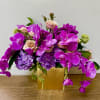 In a beautiful ceramic pot, combination of purple, hydrogen and purple orchids