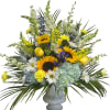 Mixed bouquet of sunflowers, hydrangeas, and daisies in a gray vase