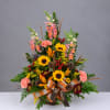 Basket arrangement with sunflowers, lilies, carnations, and snapdragons