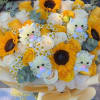 Bouquet of yellow and white roses with sunflowers and small daisy flowers