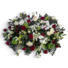 Large mixed bouquet of red and white flowers with greenery