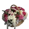 A delicate embrace of soft pink blooms, thoughtfully arranged to convey elegance