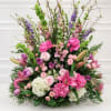 Large mixed floral arrangement with pink, purple, white, and green blooms