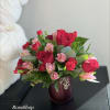 Romantic Red Rose bouquet looks ravishing inside a pearlescent scarlet vase with
