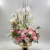 A striking statement of elegance and sophistication, this luxurious floral arrangement features