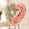 This sculpted heart arrangement is a tender, modern tribute that speaks in