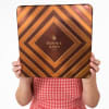 Person holding a large Bonnie & Pop gift tin