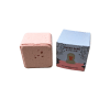 Pink bath fizzy beside its illustrated box
