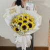 Bouquet of sunflowers with baby's breath in white and gold wrap
