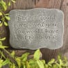 Gray memorial stone with an engraved sympathy quote