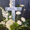 White floral cross with a memorial message for Dad