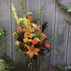 Bright colored flowers in a unique design with mixed greenery 