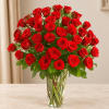 Bouquet of red roses in a clear glass vase