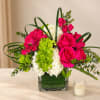 Pink roses and white hydrangeas in a square glass vase