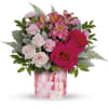 Pink and white mixed bouquet in a patterned glass vase