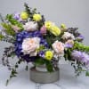 The Designer's Choice Compote Arrangement is an artistic and elegant arrangement of