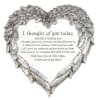 Heart-shaped silver memorial plaque with a condolence message