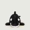 Black and white orca plush toy on a plain background