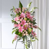 Tall pink and white floral standing spray on an easel