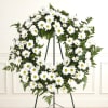 White daisy wreath on a black stand