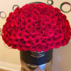 Large dome bouquet of red roses in a black hatbox